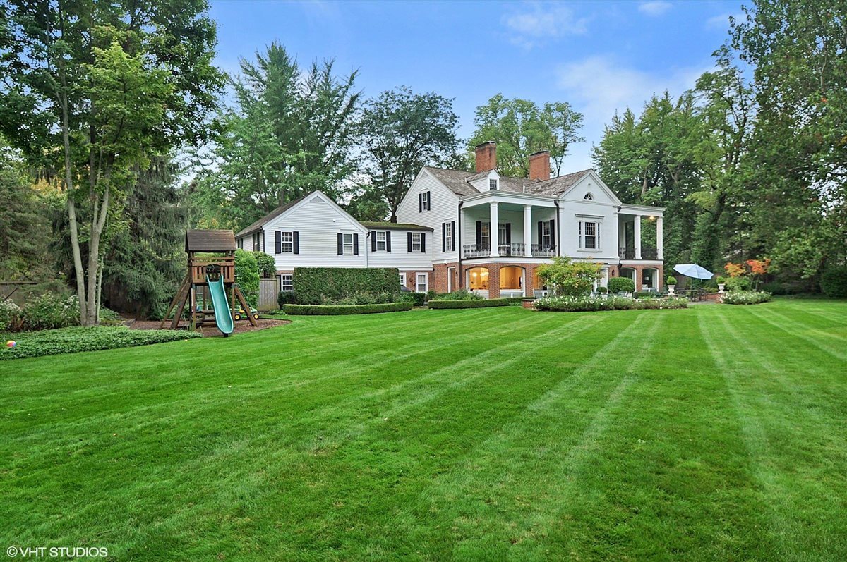 62 Woodley Road Winnetka, IL 60093 - Photo 38 of 43 a front view of a house with a garden