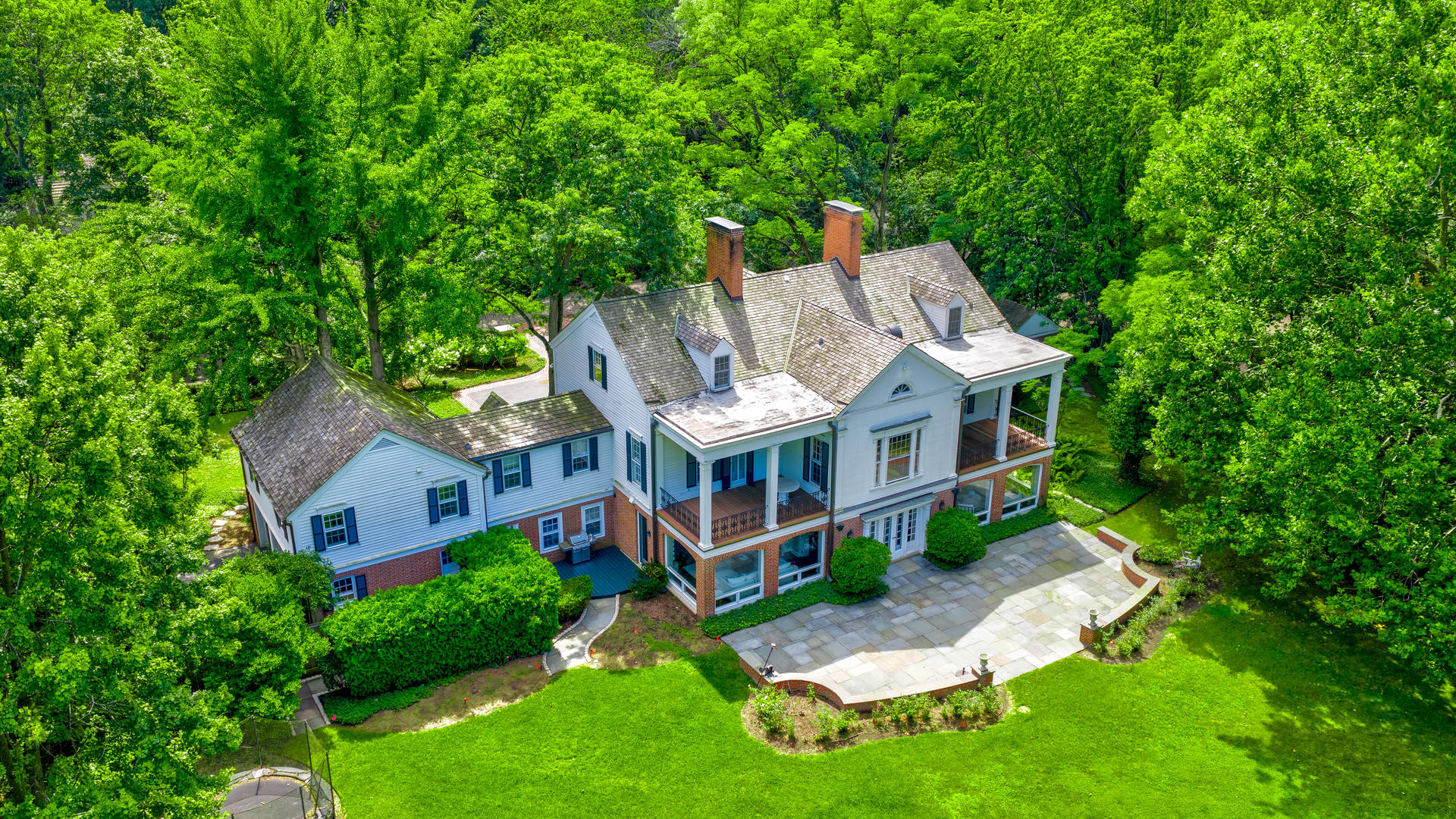 62 Woodley Road Winnetka, IL 60093 - Photo 39 of 43 aerial view of a house with a yard table and chairs