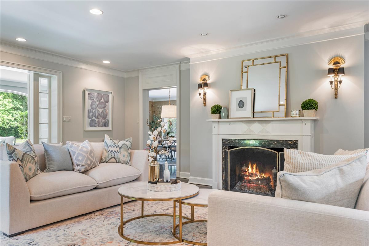 62 Woodley Road Winnetka, IL 60093 - Photo 6 of 43 a living room with furniture and a fireplace