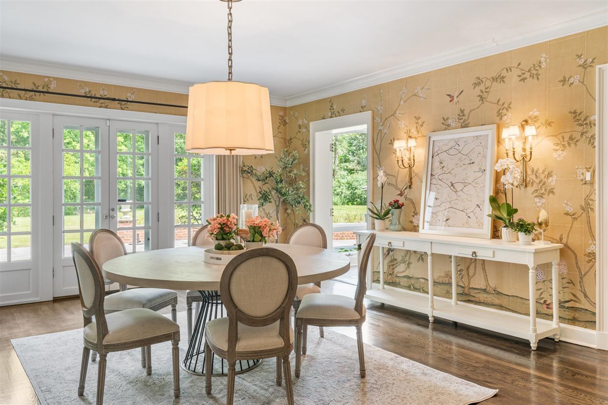 62 Woodley Road Winnetka, IL 60093 - Photo 7 of 43 a dining room with furniture a chandelier and wooden floor