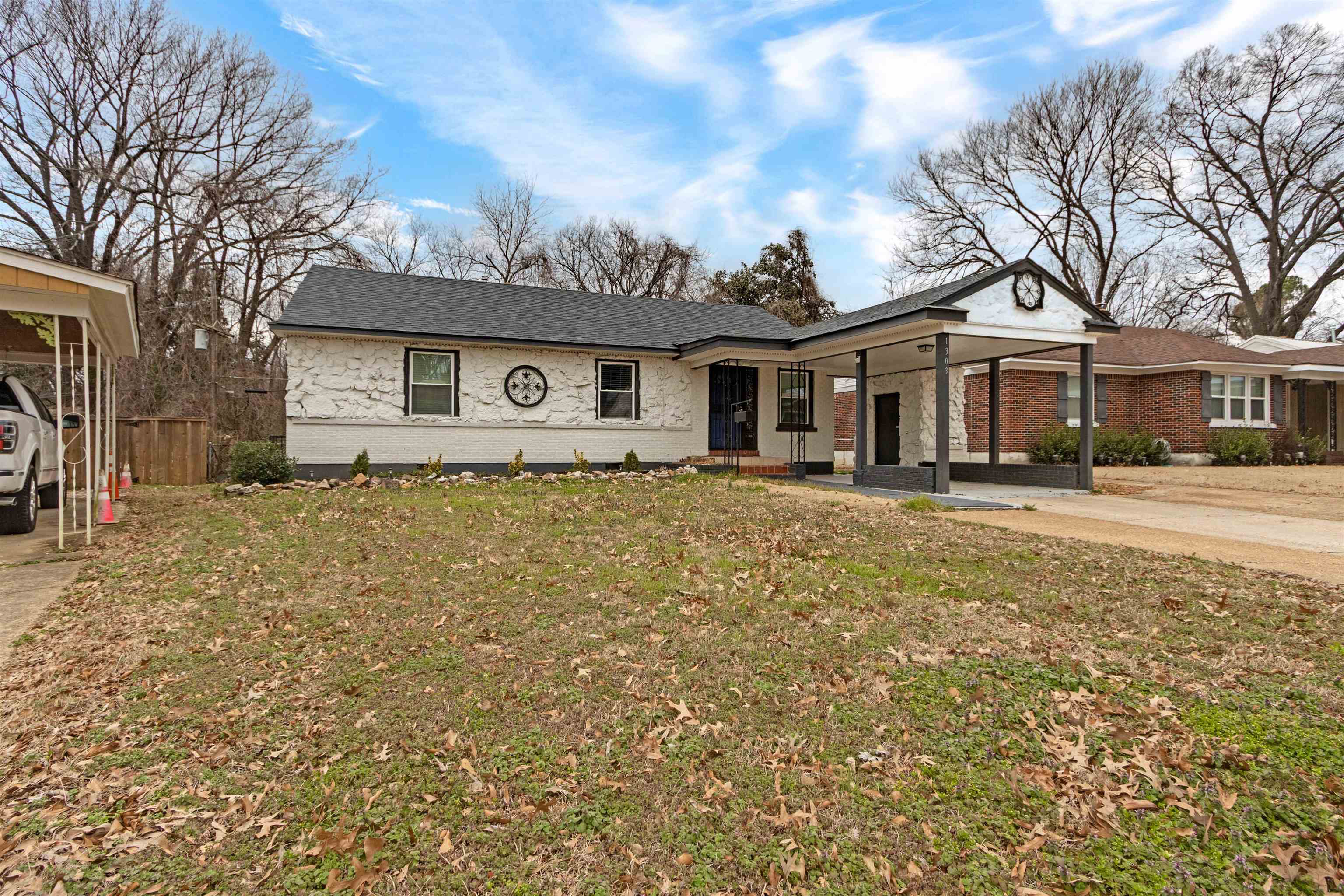 1303 Inman Road Memphis, TN 38111 - Photo 2 of 12 Single story home featuring brick siding, a front lawn, and fence
