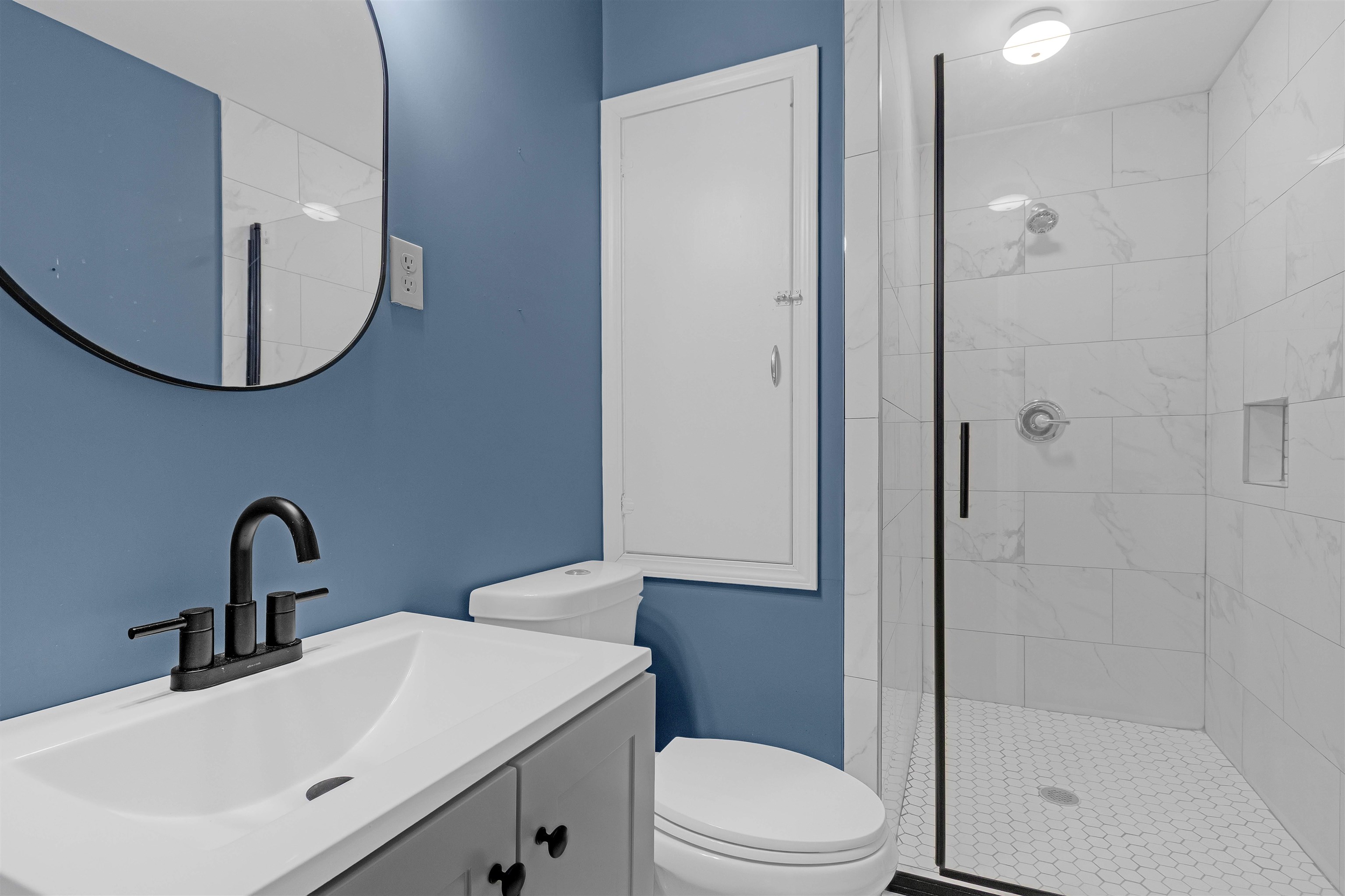 1303 Inman Road Memphis, TN 38111 - Photo 5 of 12 Bathroom with toilet, a stall shower, and vanity