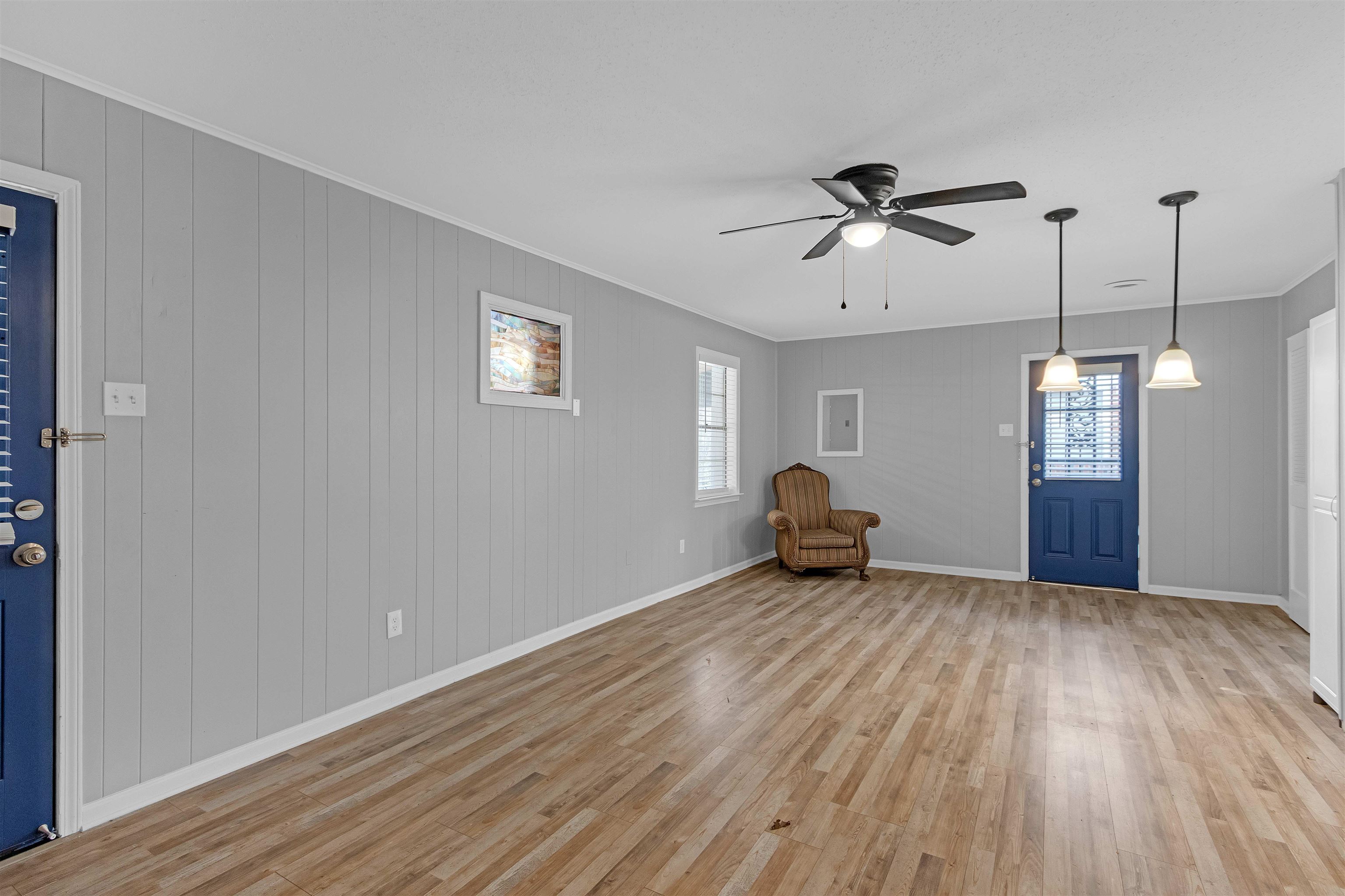 1303 Inman Road Memphis, TN 38111 - Photo 8 of 12 Entryway with crown molding, plenty of natural light, baseboards, and light wood-type flooring
