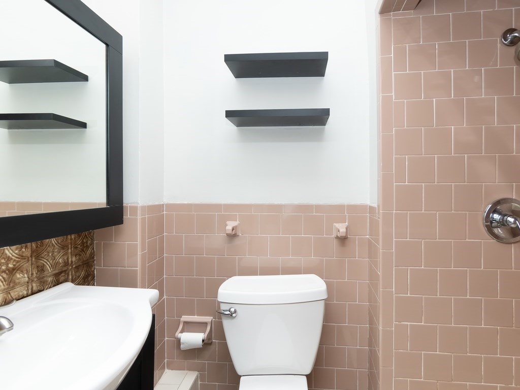 289 Meridian Street, Unit 2 Boston, MA 02128 - Photo 13 of 16 a bathroom with a toilet and a sink