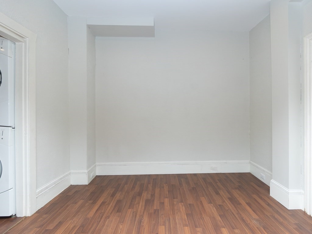 289 Meridian Street, Unit 2 Boston, MA 02128 - Photo 4 of 16 a view of an empty room with wooden floor