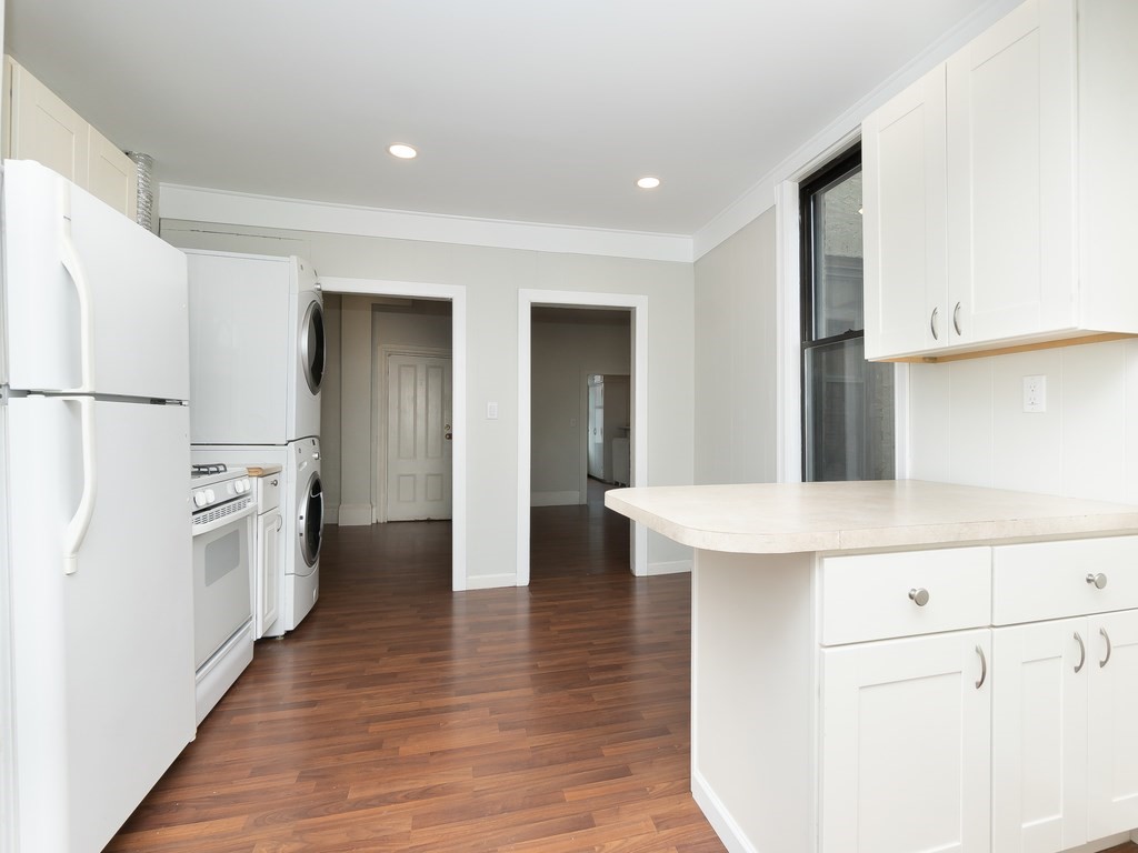 289 Meridian Street, Unit 2 Boston, MA 02128 - Photo 8 of 16 a kitchen with a refrigerator a sink and dishwasher