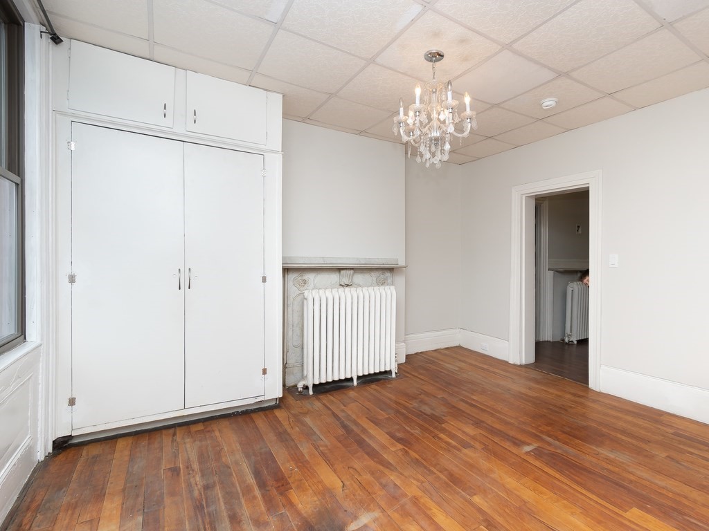 289 Meridian Street, Unit 2 Boston, MA 02128 - Photo 10 of 16 a view of an empty room with wooden floor