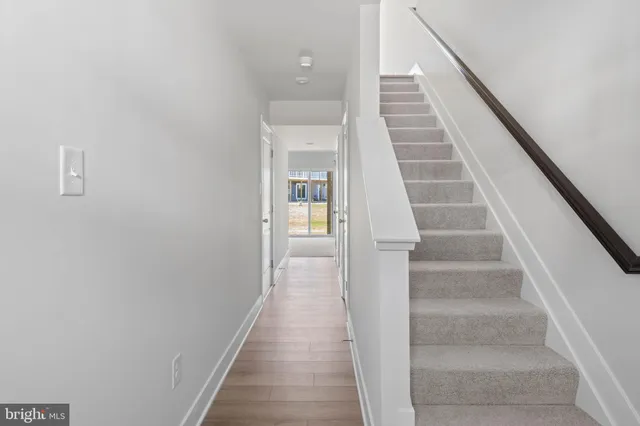 a view of staircase with white walls