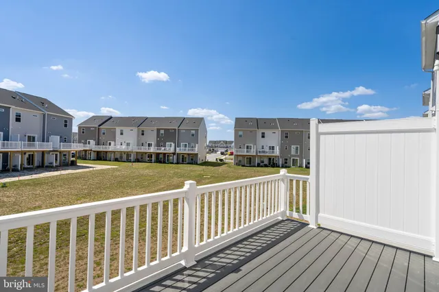 a view of a balcony with wooden floor