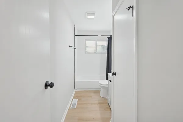 a bathroom with a shower and a toilet