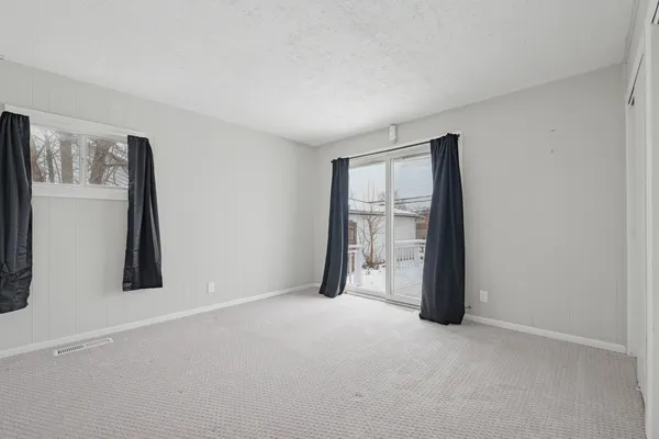 a view of an empty room with a window