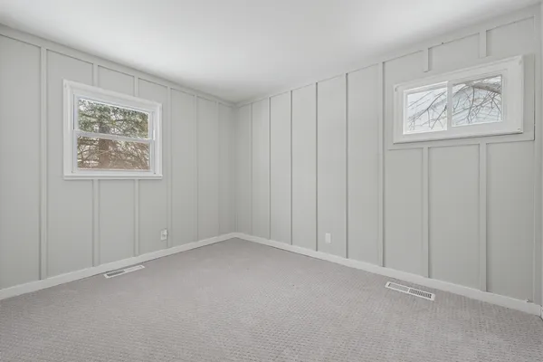 an empty room with windows