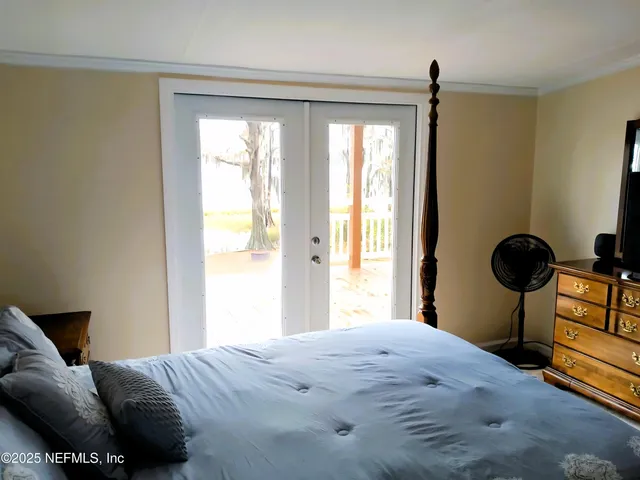 a view of walk in closet with wooden floor
