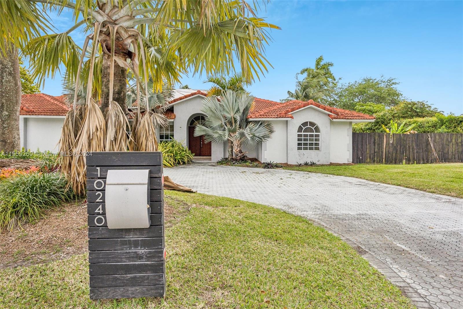 10240 Southwest 124th Street Miami, FL 33176 - Photo 1 of 81 a front view of a house with a yard