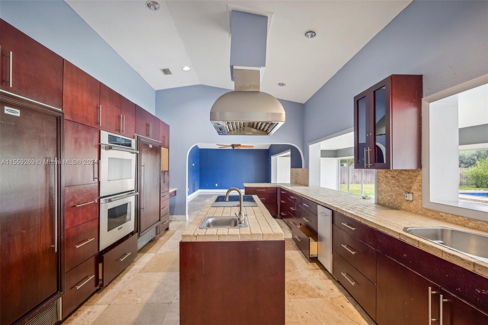 10240 Southwest 124th Street Miami, FL 33176 - Photo 12 of 81 a kitchen with stainless steel appliances granite countertop a sink and a refrigerator