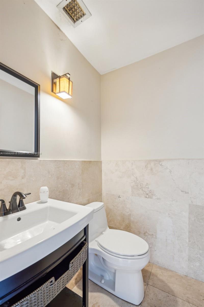 10240 Southwest 124th Street Miami, FL 33176 - Photo 15 of 81 a bathroom with a sink a toilet and mirror