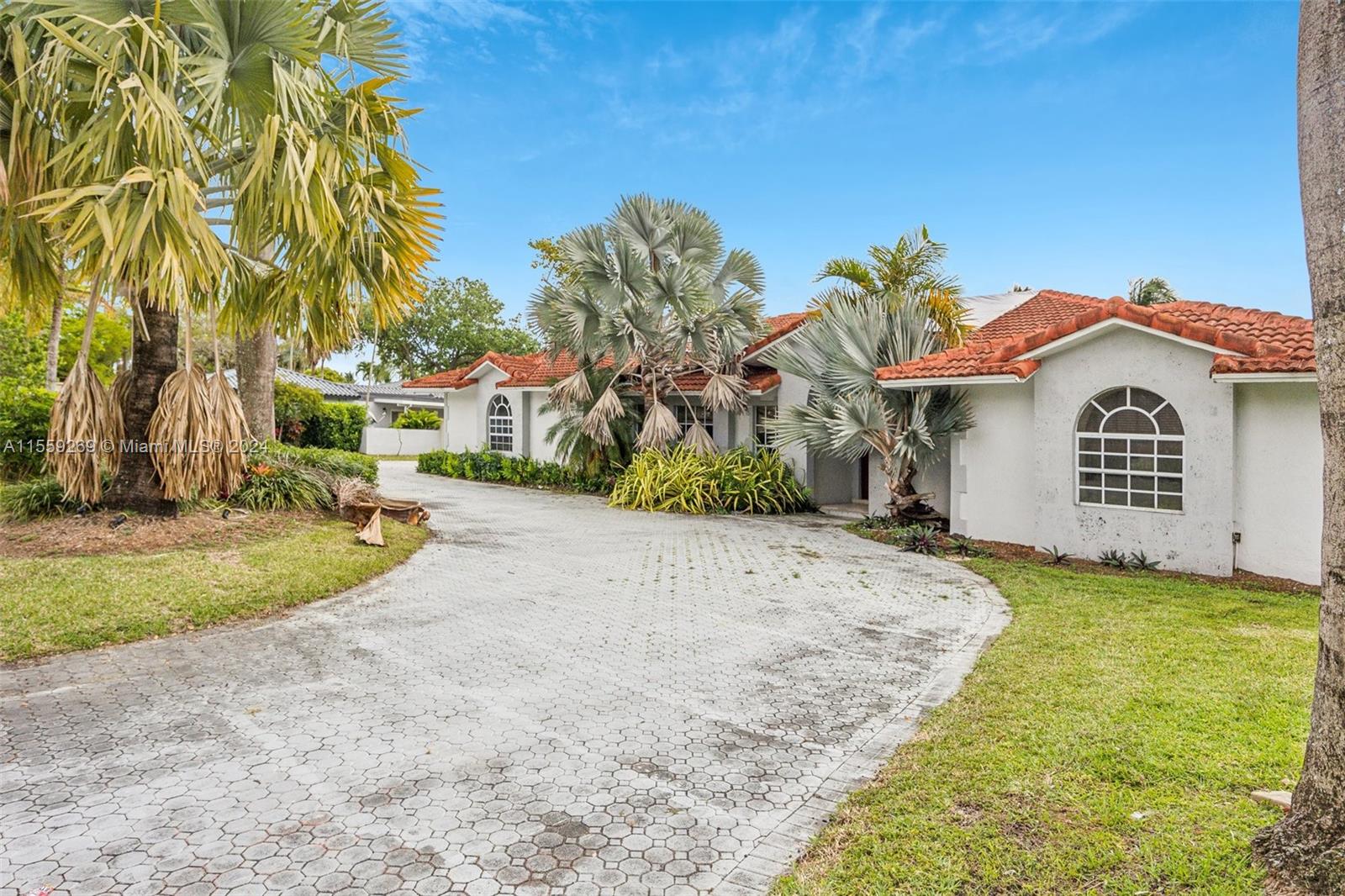 10240 Southwest 124th Street Miami, FL 33176 - Photo 34 of 81 a view of a house with a yard and garage