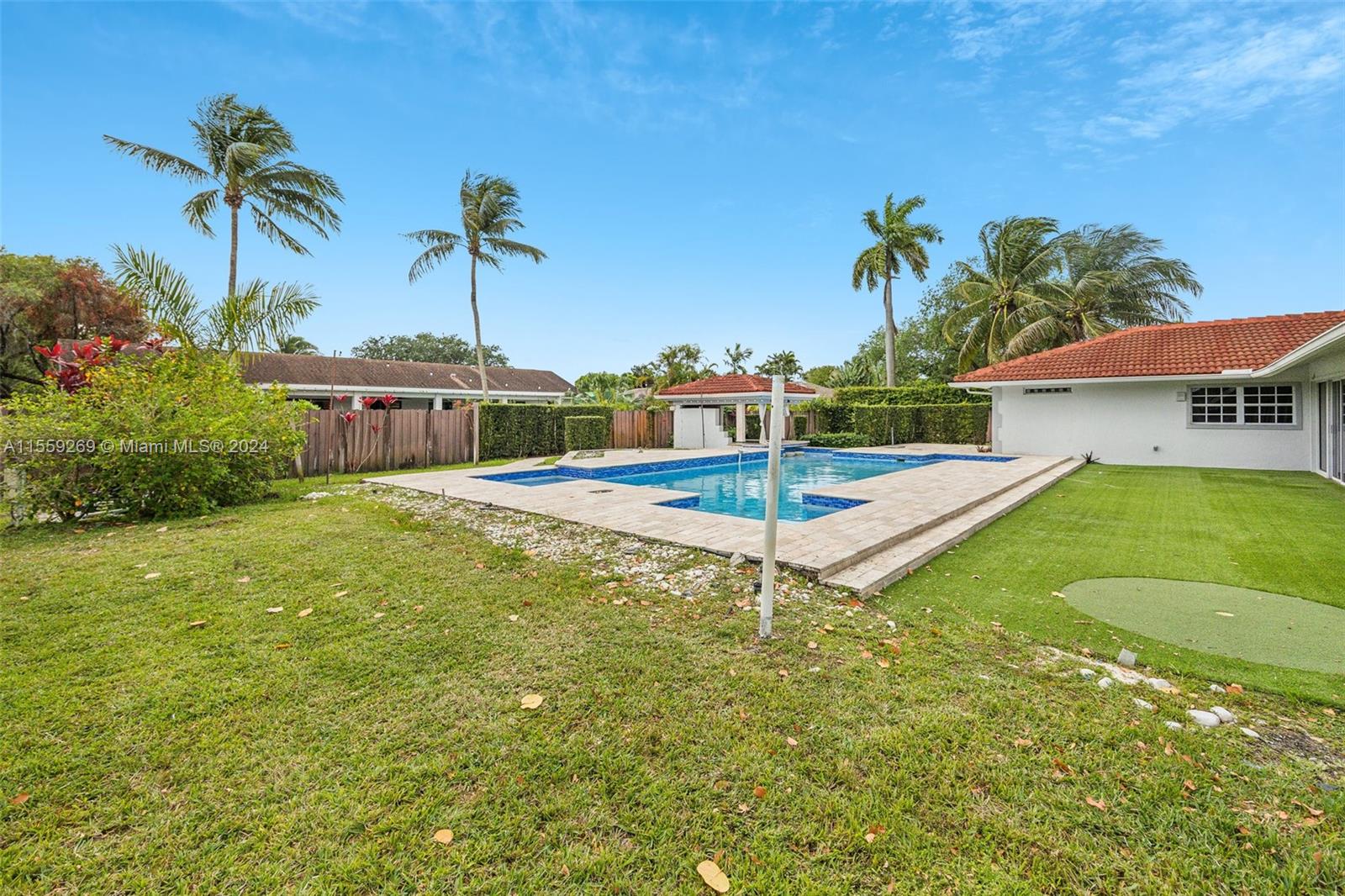 10240 Southwest 124th Street Miami, FL 33176 - Photo 40 of 81 a swimming pool with trees in front of it