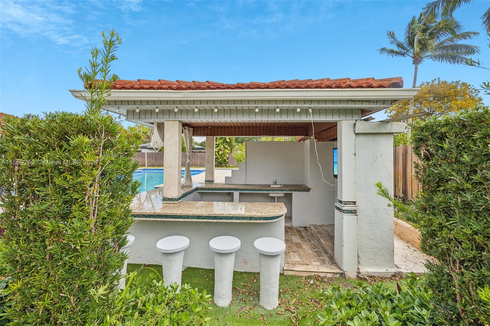 10240 Southwest 124th Street Miami, FL 33176 - Photo 48 of 81 a view of a chairs and table in front of a house