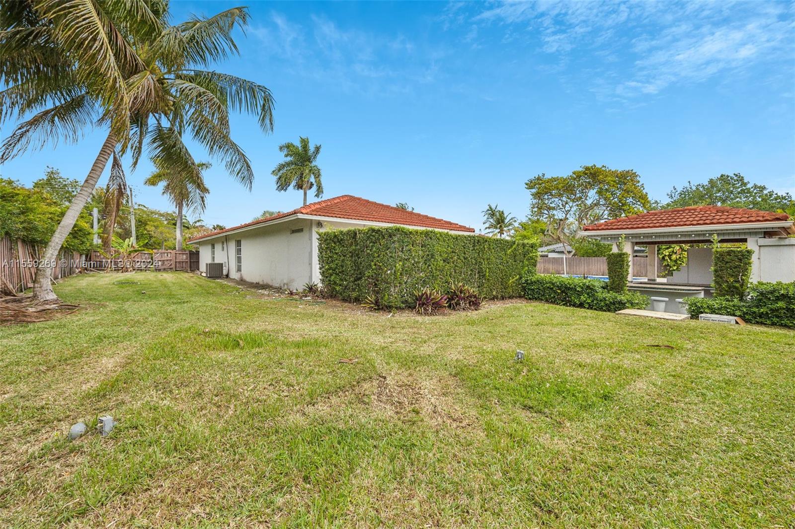 10240 Southwest 124th Street Miami, FL 33176 - Photo 49 of 81 a front view of a house with a garden