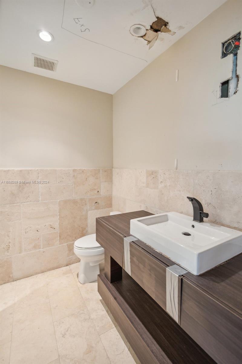 10240 Southwest 124th Street Miami, FL 33176 - Photo 69 of 81 a bathroom with a sink a toilet and shower