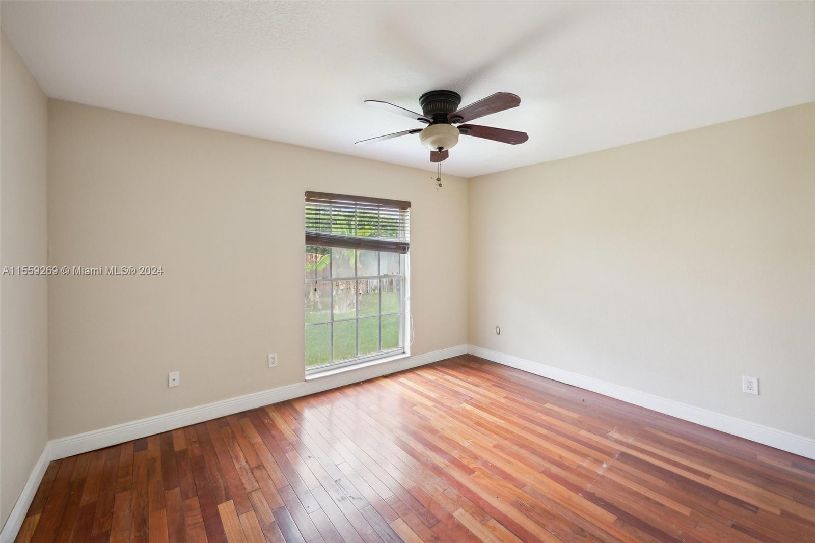10240 Southwest 124th Street Miami, FL 33176 - Photo 70 of 81 a view of an empty room with wooden floor and a window