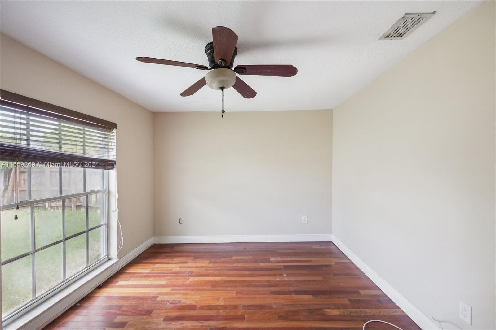 10240 Southwest 124th Street Miami, FL 33176 - Photo 71 of 81 a view of an empty room with wooden floor and a window