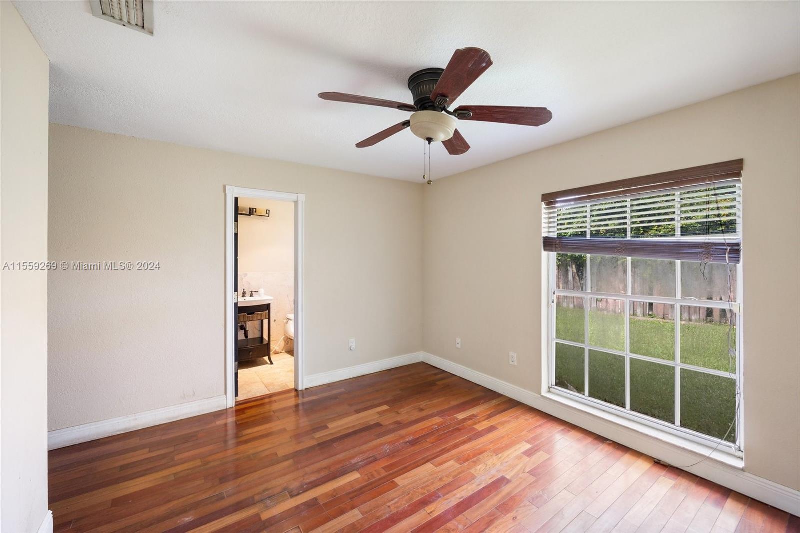 10240 Southwest 124th Street Miami, FL 33176 - Photo 72 of 81 a view of empty room with wooden floor and fan