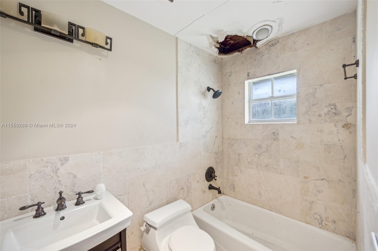 10240 Southwest 124th Street Miami, FL 33176 - Photo 73 of 81 a bathroom with a sink mirror and a bathtub