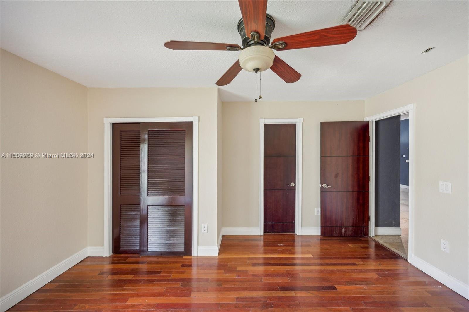 10240 Southwest 124th Street Miami, FL 33176 - Photo 77 of 81 a view of an empty room with wooden floor and fan
