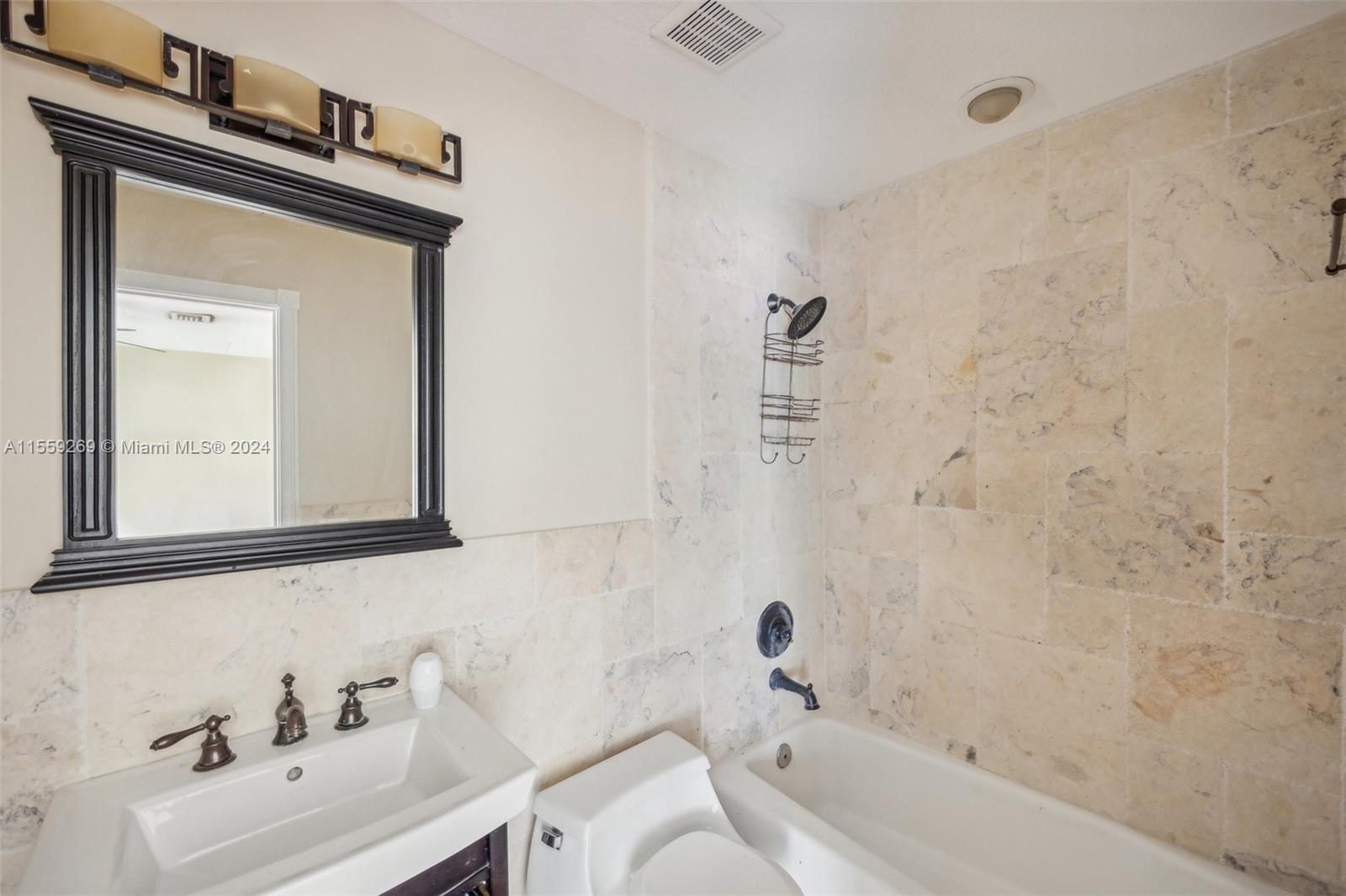 10240 Southwest 124th Street Miami, FL 33176 - Photo 78 of 81 a bathroom with a sink a toilet and a bathtub