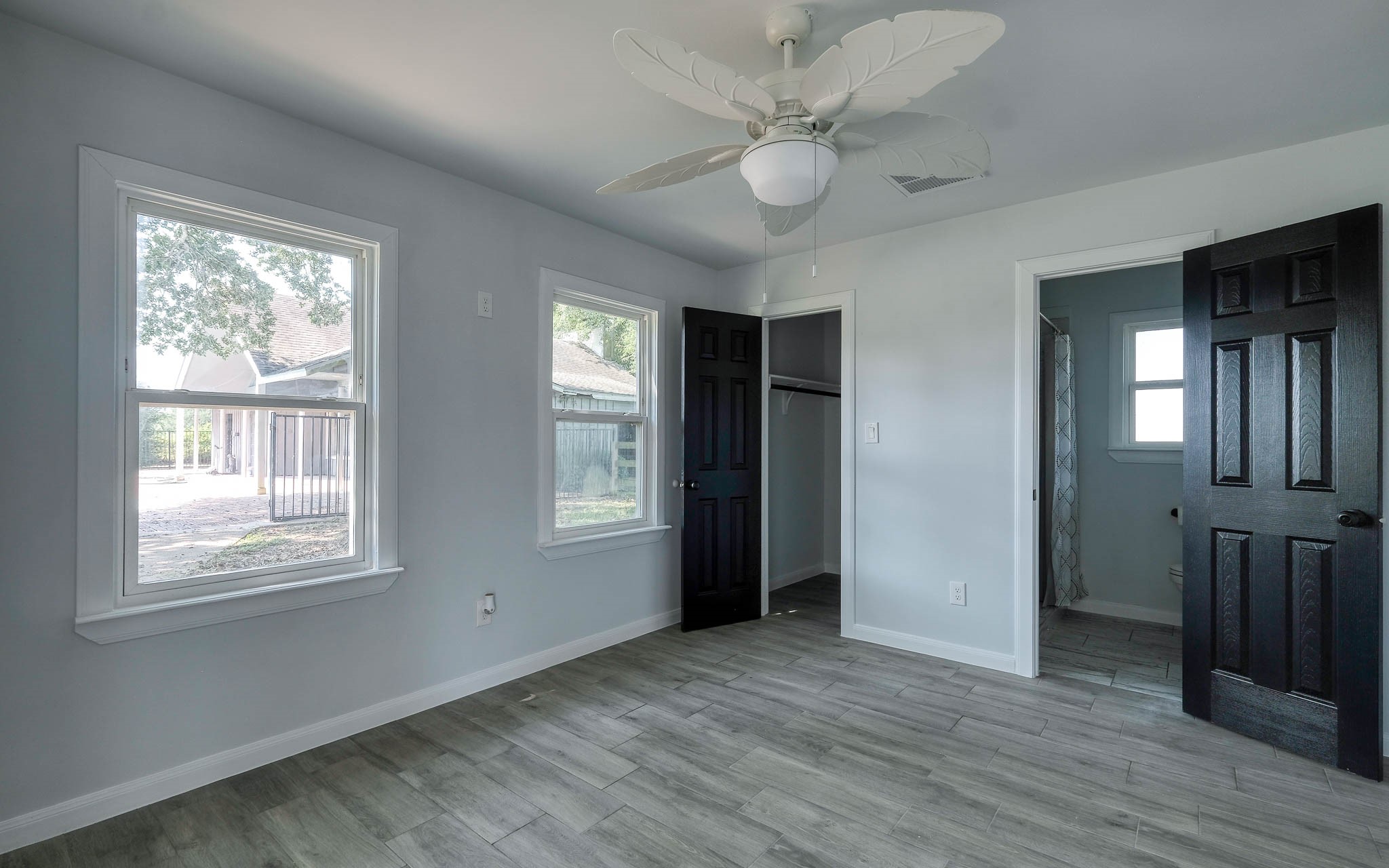 20515 Kickapoo Road Waller, TX 77484 - Photo 29 of 50 a view of an empty room with wooden floor and a window