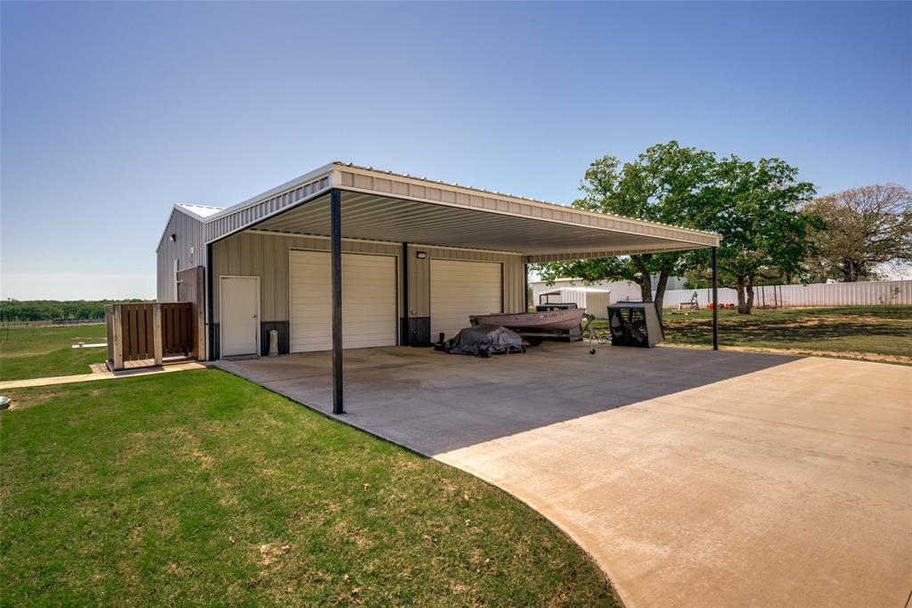 250 Belcher Road Bowie, TX 76230 - Photo 33 of 38 outdoor shower by shop with covered parking
