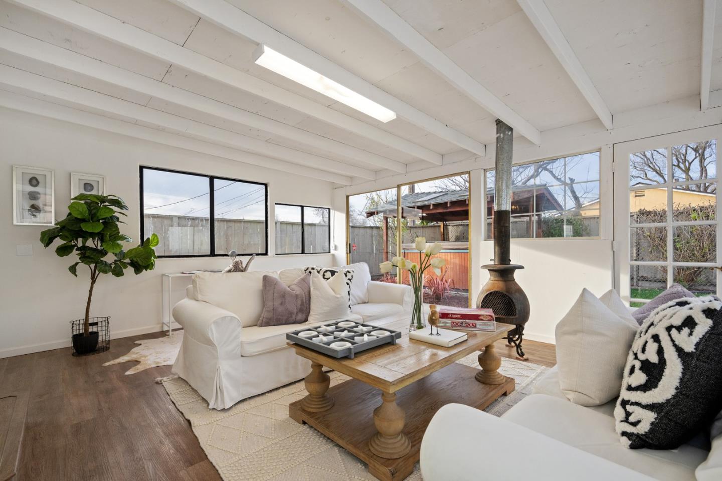 1849 Girard Drive Milpitas, CA 95035 - Photo 16 of 33 a living room with furniture potted plant and a large window