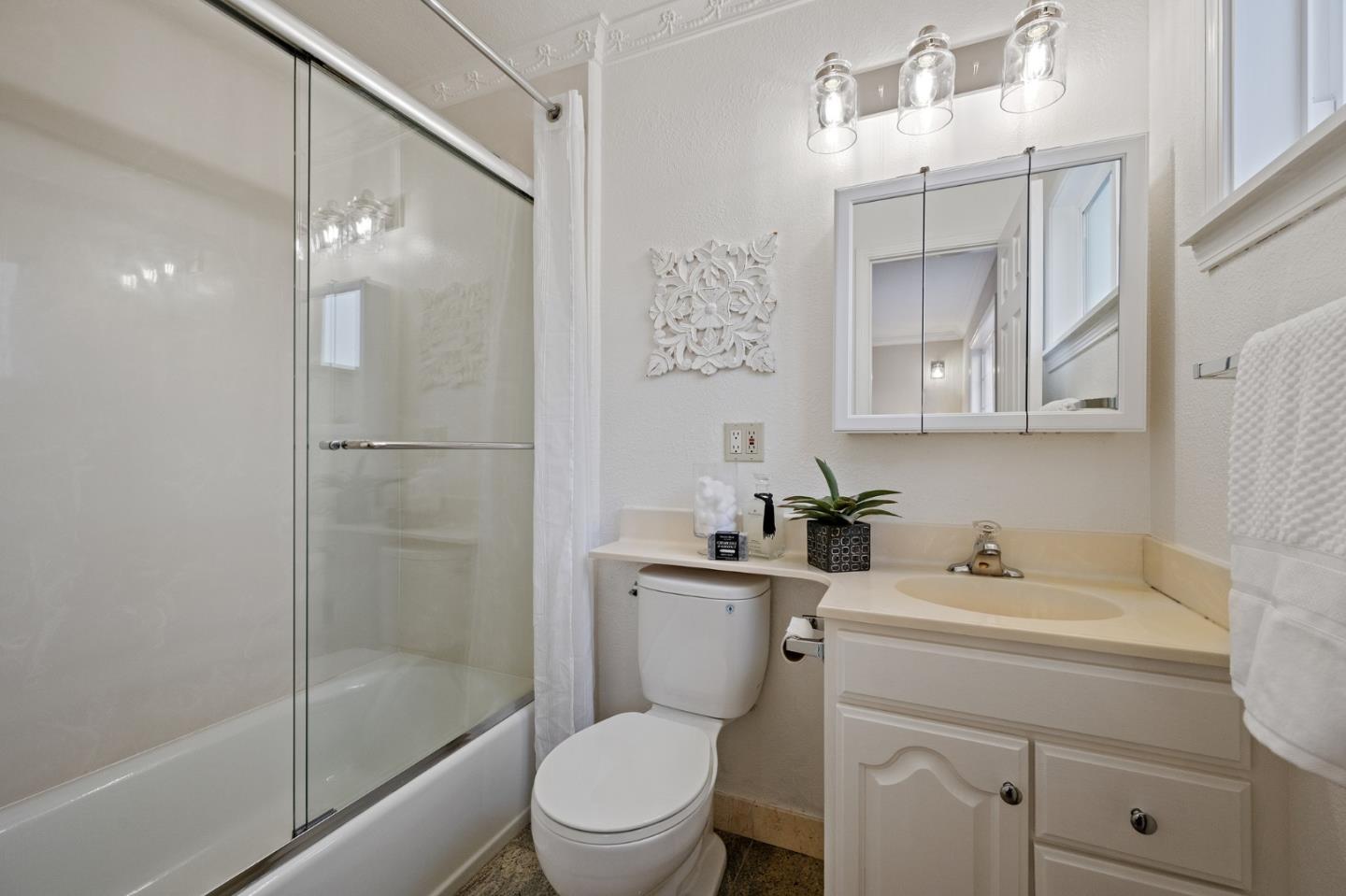 1849 Girard Drive Milpitas, CA 95035 - Photo 24 of 33 a bathroom with a toilet sink shower and mirror