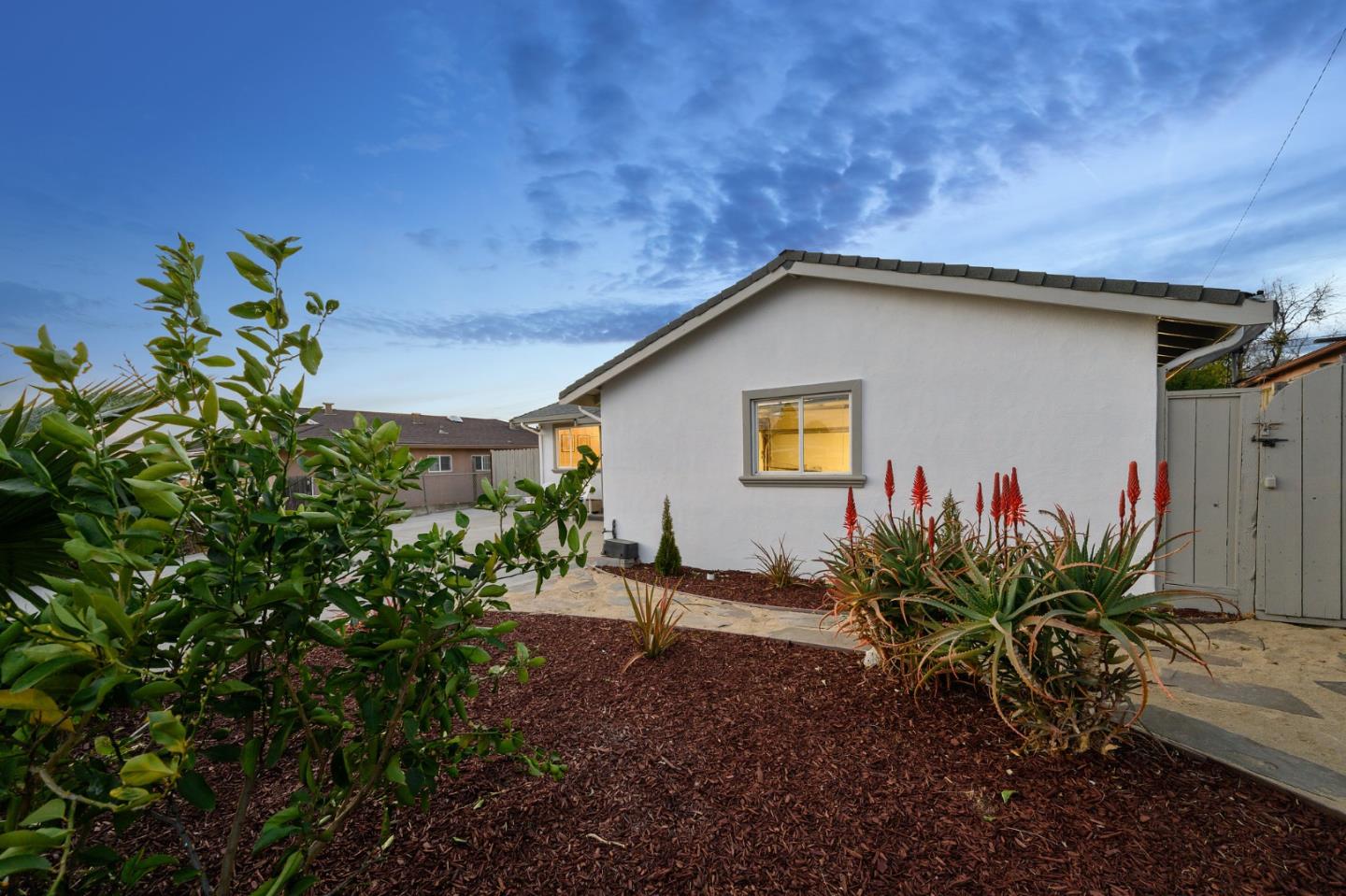 1849 Girard Drive Milpitas, CA 95035 - Photo 3 of 33 a house with a flower garden