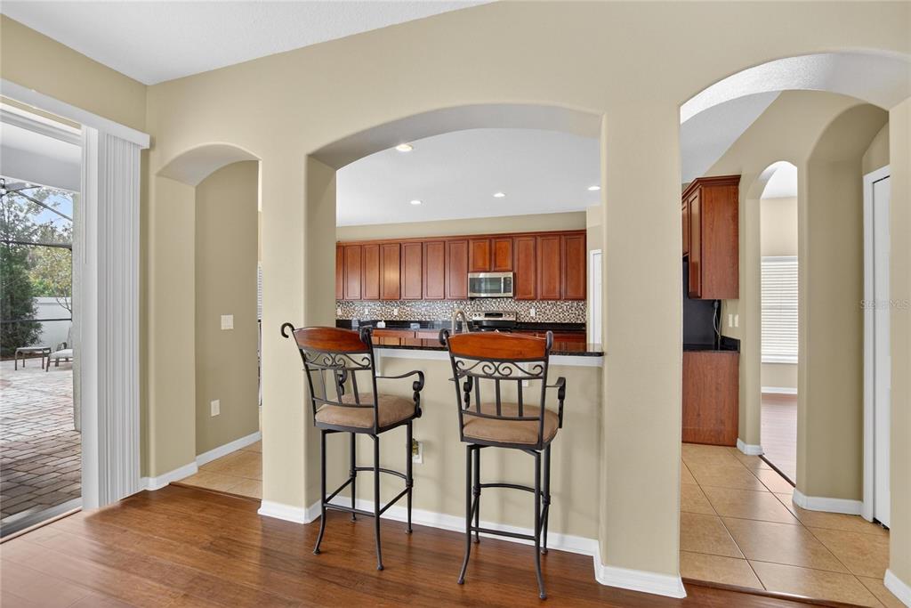 11543 Addison Chase Drive Riverview, FL 33579 - Photo 12 of 45 a view of a dining room with furniture and wooden floor