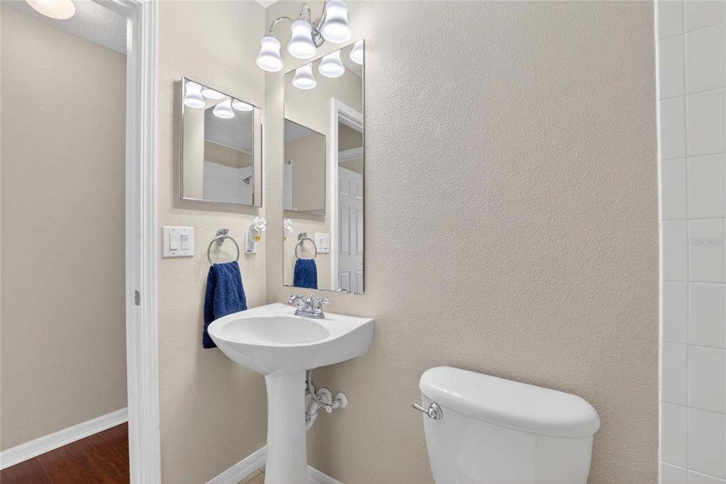 11543 Addison Chase Drive Riverview, FL 33579 - Photo 19 of 45 a bathroom with a toilet sink and mirror