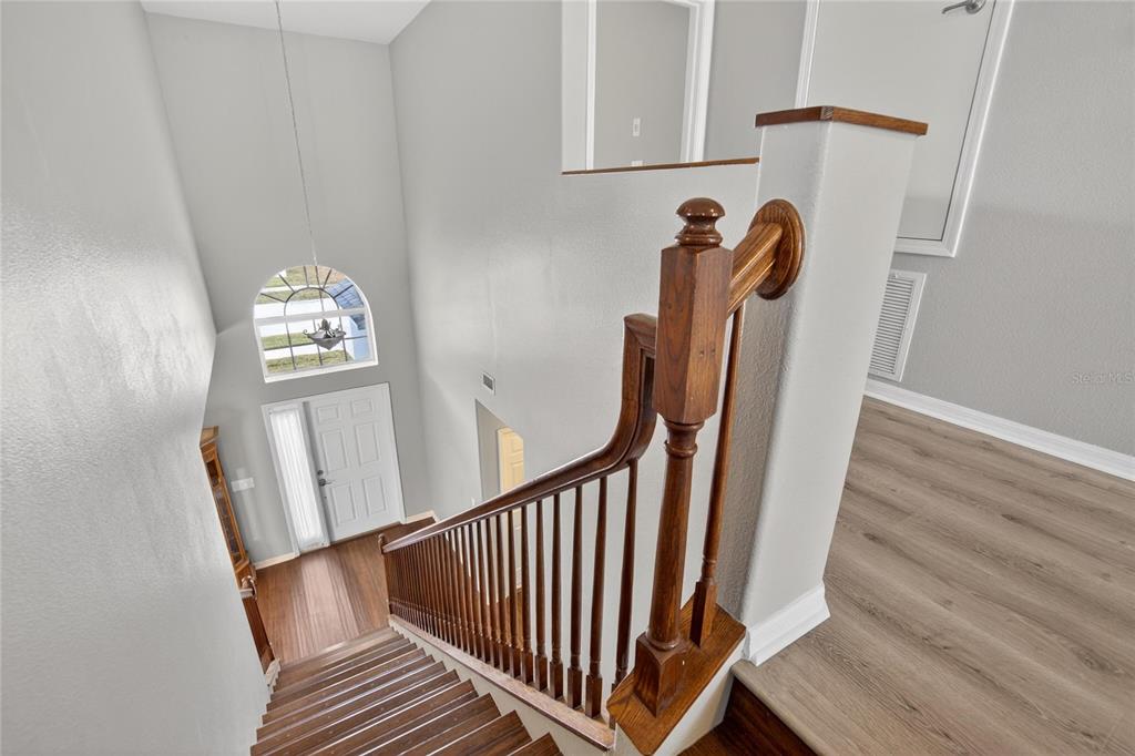11543 Addison Chase Drive Riverview, FL 33579 - Photo 20 of 45 a view of staircase with white walls and railing
