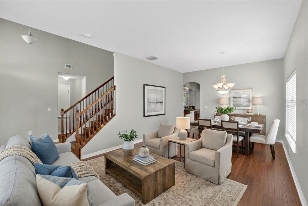 11543 Addison Chase Drive Riverview, FL 33579 - Photo 3 of 45 a living room with furniture and wooden floor