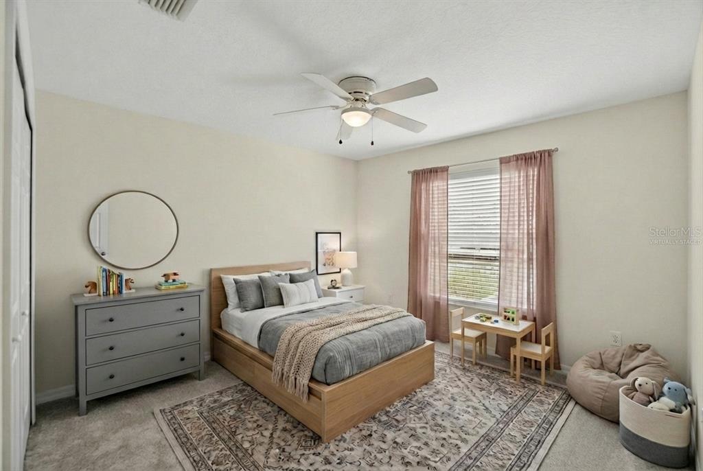 11543 Addison Chase Drive Riverview, FL 33579 - Photo 32 of 45 a bedroom with a bed and window