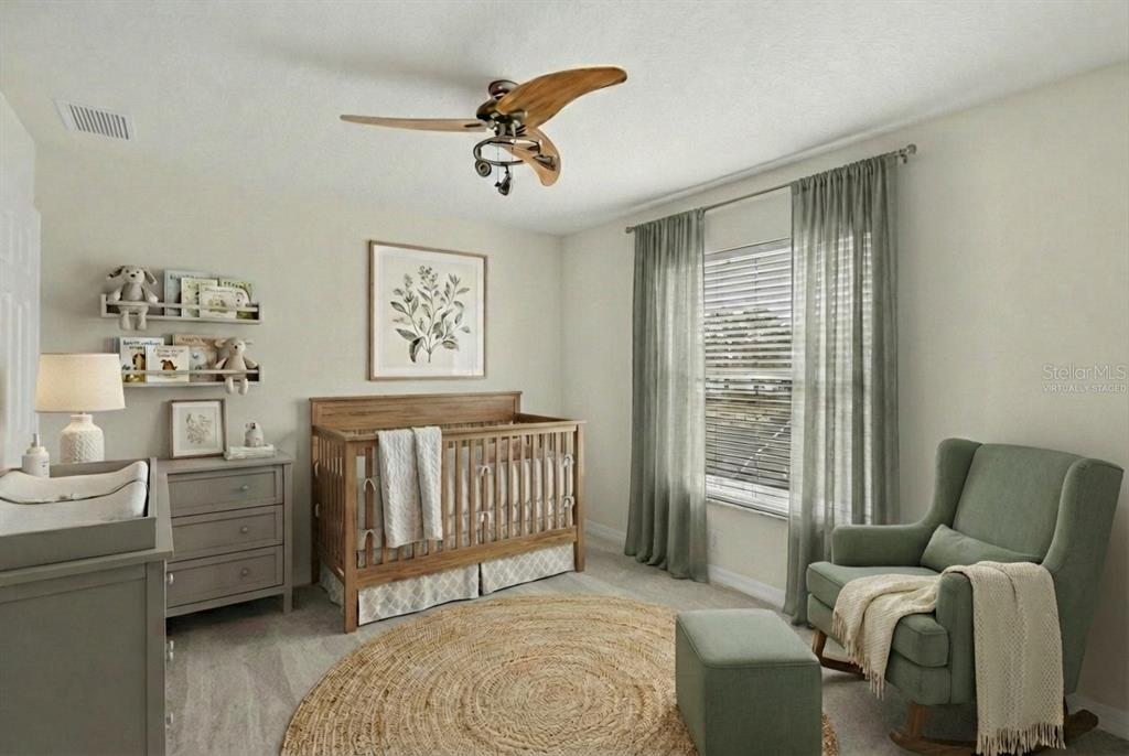 11543 Addison Chase Drive Riverview, FL 33579 - Photo 35 of 45 a bedroom with furniture and a window