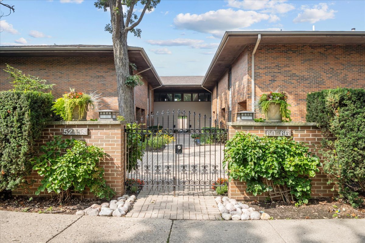 62 East Center Avenue, Unit 62 Lake Bluff, IL 60044 - Photo 1 of 19 a view of a house with a small garden