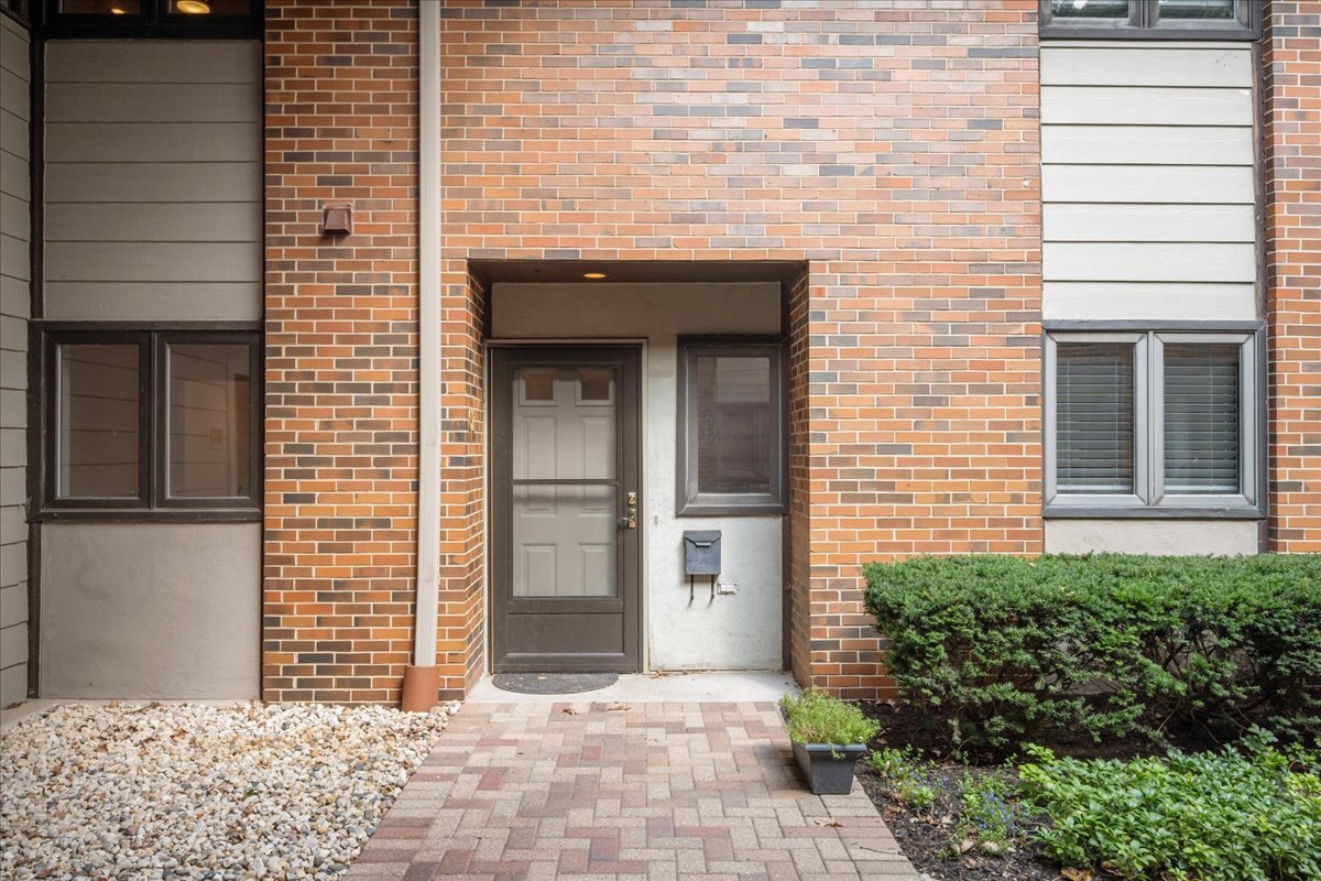 62 East Center Avenue, Unit 62 Lake Bluff, IL 60044 - Photo 3 of 19 a view of a wooden door and a window