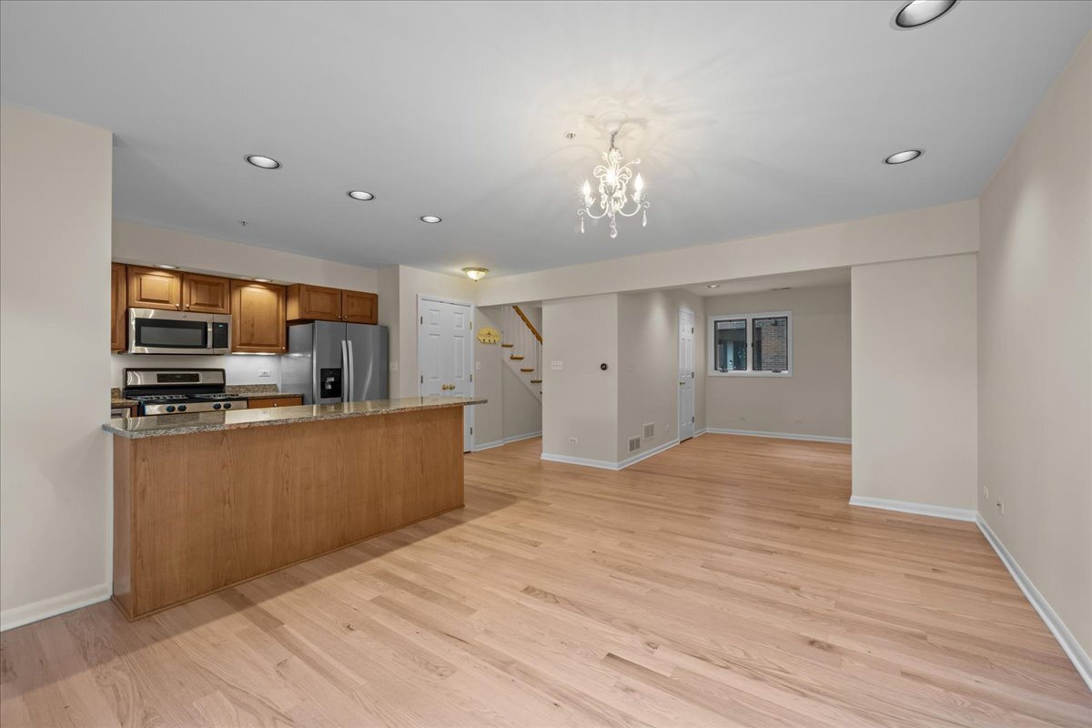 62 East Center Avenue, Unit 62 Lake Bluff, IL 60044 - Photo 6 of 19 a view of a kitchen with microwave and cabinets