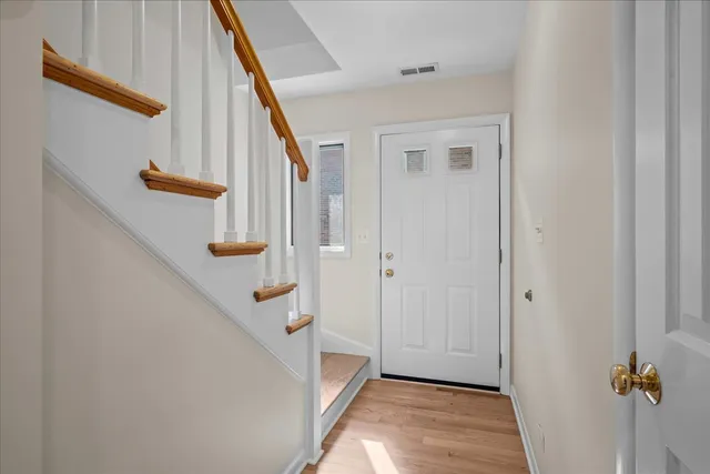 a view of a hallway with stairs