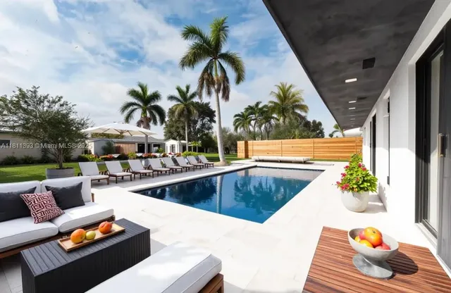 a swimming pool with outdoor seating