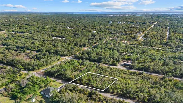a view of a lake with a yard