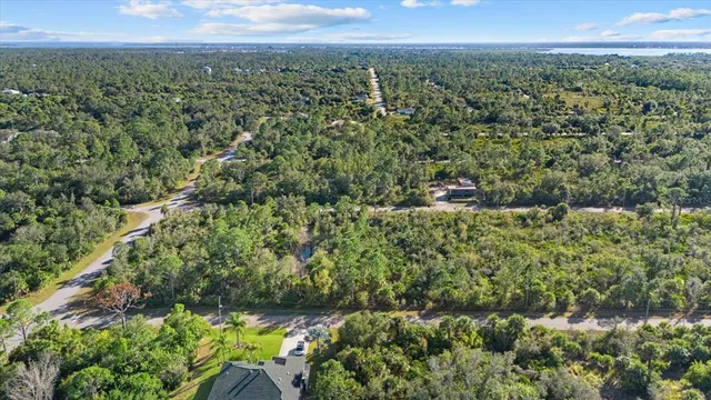 a view of a lake with a yard