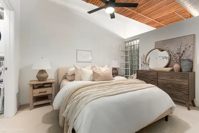 a bedroom with a bed and a dresser